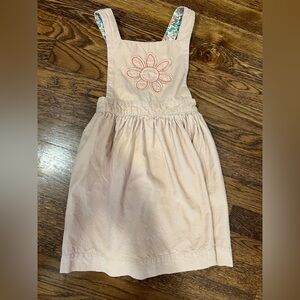 Mini Boden corduroy pinnie with flower appliqué
